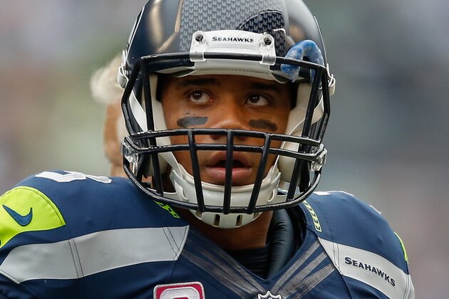 SEATTLE, WA - OCTOBER 12:  Quarterback Russell Wilson #3 of the Seattle Seahawks looks at the scoreboard during a timeout against the Dallas Cowboys at CenturyLink Field on October 12, 2014 in Seattle, Washington. The Cowboys defeated the Seahawks 30-23. (Photo by Otto Greule Jr/Getty Images)