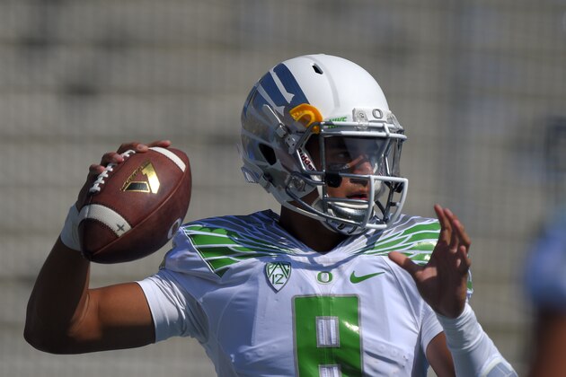 Oregon quarterback Marcus Mariota warms up prior to a college football game against UCLA, Saturday, Oct. 11, 2014, in Pasadena, Calif.  (AP Photo/Mark J. Terrill)