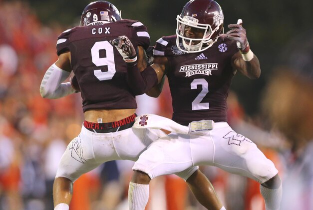 Oct 11, 2014; Starkville, MS, USA; Mississippi State Bulldogs defensive back Will Redmond (2) and Mississippi State Bulldogs defensive back Justin Cox (9) celebrate after a reception during the game against the Auburn Tigers at Davis Wade Stadium. Mississippi State Bulldogs defeated the Auburn Tigers 38-23.  Mandatory Credit: Spruce Derden-USA TODAY Sports