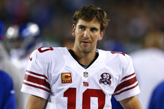 New York Giants quarterback Eli Manning stands on the sideline during the second half of an NFL football game against the Philadelphia Eagles, Sunday, Oct. 12, 2014, in Philadelphia. (AP Photo/Matt Rourke)