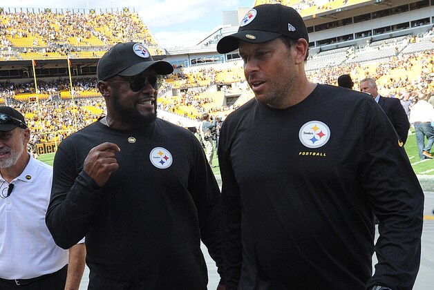 Pittsburgh Steelers head coach Mike Tomlin and offensive coordinator Todd Haley walk off of the field after of an NFL football game against the Cleveland Browns on Sunday, Sept. 7, 2014, in Pittsburgh. Pittsburgh won 30-27. (AP Photo/Don Wright)