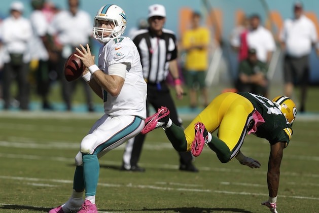 Miami Dolphins quarterback Ryan Tannehill (17) looks to pass during the second half of an NFL football game against the Green Bay Packers, Sunday, Oct. 12, 2014, in Miami Gardens, Fla. (AP Photo/Wilfredo Lee)