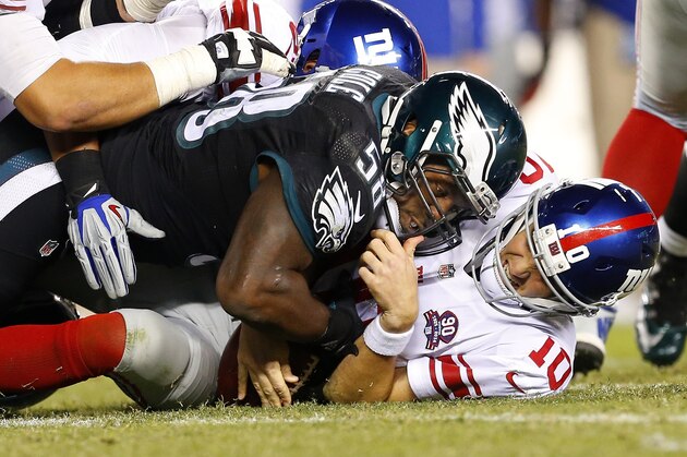 PHILADELPHIA, PA - OCTOBER 12: Trent Cole #58 and Connor Barwin #98 of the Philadelphia Eagles sacks Eli Manning #10 of the New York Giants during the fourth quarter of a football game at Lincoln Financial Field on October 12, 2014 in Philadelphia, Pennsylvania. The eagles defeated the Giants 27-0. (Photo by Rich Schultz /Getty Images)