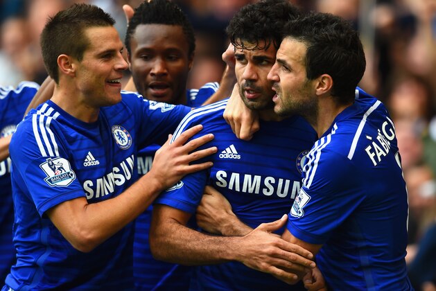 LONDON, ENGLAND - OCTOBER 05:  Diego Costa of Chelsea celebrates scoring their second goal with Cesar Azpilicueta and Cesc Fabregas of Chelsea during the Barclays Premier League match between Chelsea and Arsenal at Stamford Bridge on October 4, 2014 in London, England.  (Photo by Shaun Botterill/Getty Images)