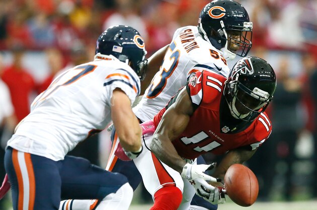 ATLANTA, GA - OCTOBER 12:  Julio Jones #11 of the Atlanta Falcons fails to pull in this reception against Darryl Sharpton #53 and Chris Conte #47 of the Chicago Bears at Georgia Dome on October 12, 2014 in Atlanta, Georgia.  (Photo by Kevin C. Cox/Getty Images)