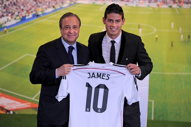 MADRID, SPAIN - JULY 22:  James Rodriguez holds his new Real shirt beside club president Florentino Perez during his unveiling as a new Real Madrid player at the Santaigo Bernabeu stadium on July 22, 2014 in Madrid, Spain. Real agreed to buy Rodriguez from AS Monaco for the next six seasons for an undisclosed transfer fee.  (Photo by Denis Doyle/Getty Images)