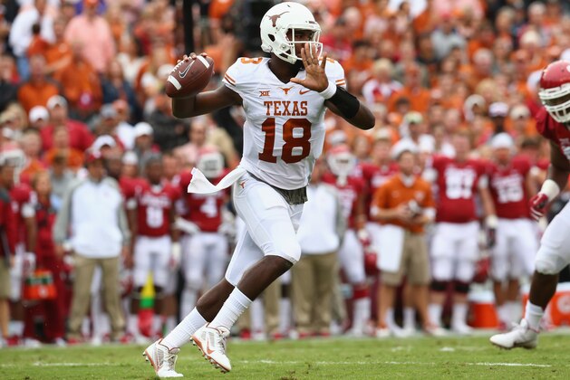 DALLAS, TX - OCTOBER 11:  Tyrone Swoopes #18 of the Texas Longhorns throws against the Oklahoma Sooners at Cotton Bowl on October 11, 2014 in Dallas, Texas.  (Photo by Ronald Martinez/Getty Images)