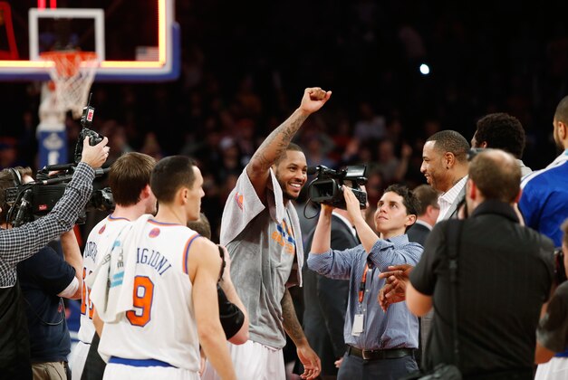 Jan 24, 2014; New York, NY, USA; New York Knicks small forward Carmelo Anthony (7) reacts after scoring 62 points against the Charlotte Bobcats at Madison Square Garden. Mandatory Credit: Noah K. Murray-USA TODAY Sports