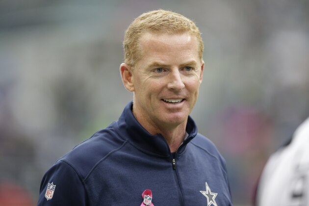 Dallas Cowboys head coach Jason Garrett stands on the sideline in the first half of an NFL football game against the Seattle Seahawks, Sunday, Oct. 12, 2014, in Seattle. (AP Photo/Scott Eklund)