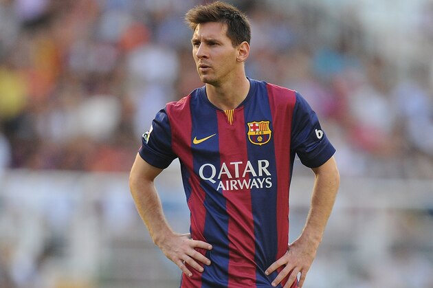MADRID, SPAIN - OCTOBER 04:  Lionel Messi of FC Barcelona lines-up a free kick during the La Liga match between Rayo Vallecano de Madrid and FC Barcelona at Estadio Teresa Rivero on October 4, 2014 in Madrid, Spain.  (Photo by Denis Doyle/Getty Images)