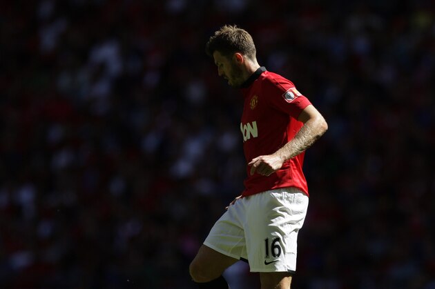 Manchester United's Michael Carrick during his team's English FA Community Shield soccer match against Wigan Athletic at Wembley Stadium in London, Sunday, Aug. 11, 2013. (AP Photo/Jon Super)