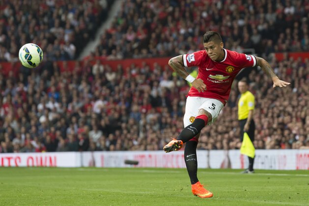 Manchester United's Marcos Rojo is seen during his team's English Premier League soccer match against Queens Park Rangers at Old Trafford Stadium, Manchester, England, Sunday Sept. 14, 2014. (AP Photo/Jon Super)