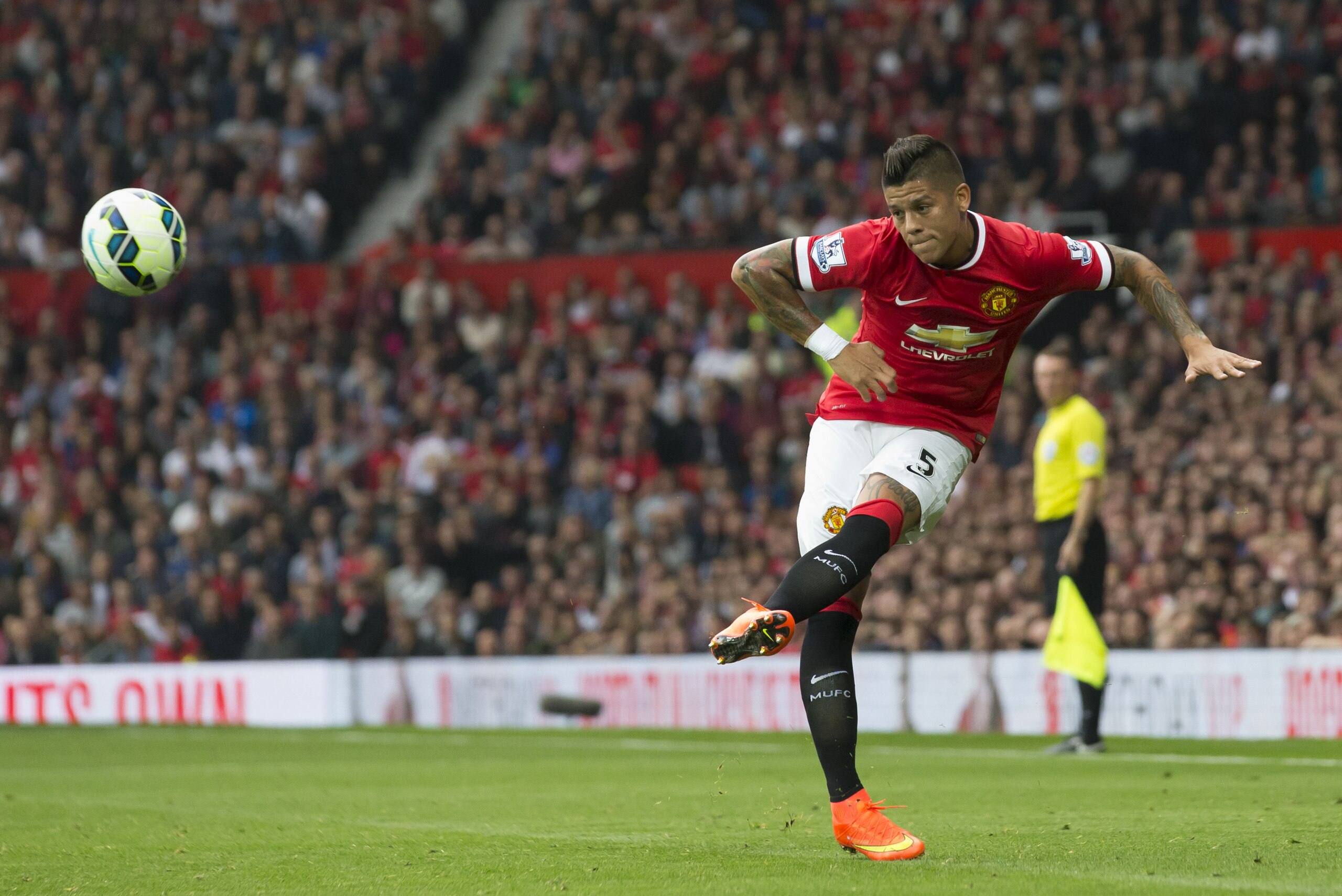 Manchester United's Marcos Rojo is seen during his team's English Premier League soccer match against Queens Park Rangers at Old Trafford Stadium, Manchester, England, Sunday Sept. 14, 2014. (AP Photo/Jon Super)