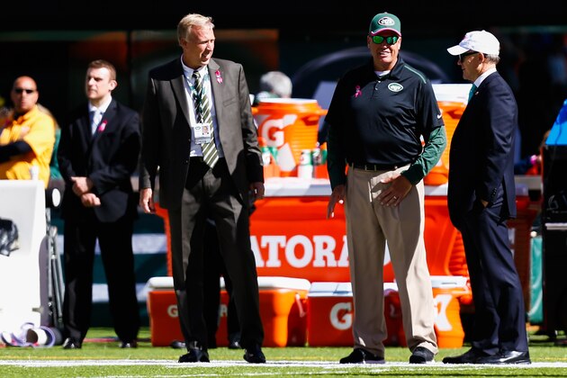 EAST RUTHERFORD, NJ - OCTOBER 12: New York Jets general manager John Idzik (L) stands with head coach Rex Ryan (C) and owner Woody Johnson (R) before a game against the Denver Broncos at MetLife Stadium on October 12, 2014 in East Rutherford, New Jersey.  (Photo by Jeff Zelevansky/Getty Images)