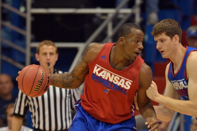 Oct 10, 2014; Kansas, MO, USA; Kansas Jayhawks forward Cliff Alexander (2) dribbles the ball as guard Sviatoslav Mykhailiuk (10) defends during Late Night at the Phog at Allen Fieldhouse. Mandatory Credit: Denny Medley-USA TODAY Sports