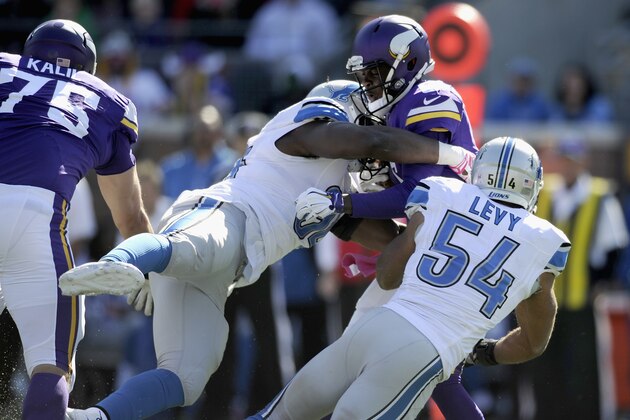 MINNEAPOLIS, MN - OCTOBER 12: Ezekiel Ansah #94 and DeAndre Levy #54 of the Detroit Lions sack Teddy Bridgewater #5 of the Minnesota Vikings during the second quarter of the game on October 12, 2014 at TCF Bank Stadium in Minneapolis, Minnesota. (Photo by Hannah Foslien/Getty Images)