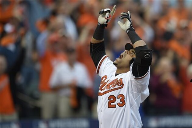 Baltimore Orioles designated hitter Nelson Cruz gestures after his two-run home run in the first inning against the Detroit Tigers during Game 1 of baseball's AL Division Series, Thursday, Oct. 2, 2014, in Baltimore. (AP Photo/Nick Wass)