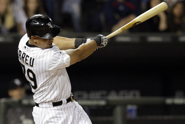 Chicago White Sox's Jose Abreu hits a two-run home run during the first inning of a baseball game against the Kansas City Royals in Chicago on Saturday, Sept. 27, 2014. (AP Photo/Nam Y. Huh)