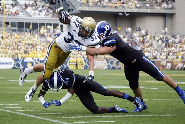 Oct 11, 2014; Atlanta, GA, USA; Georgia Tech Yellow Jackets running back Zach Laskey (37) is pushed out of bounds by Duke Blue Devils cornerback Breon Borders (31) and linebacker David Helton (47) in the second quarter at Bobby Dodd Stadium. Mandatory Credit: Brett Davis-USA TODAY Sports