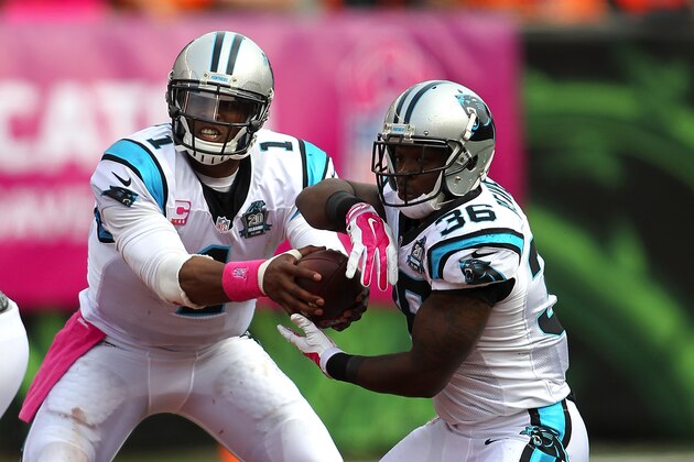 CINCINNATI, OH - OCTOBER 12:  Cam Newton #1 of the Carolina Panthers fakes a handoff to Darrin Reaves #36 during the third quarter against the Cincinnati Bengals at Paul Brown Stadium on October 12, 2014 in Cincinnati, Ohio. (Photo by John Grieshop/Getty Images)