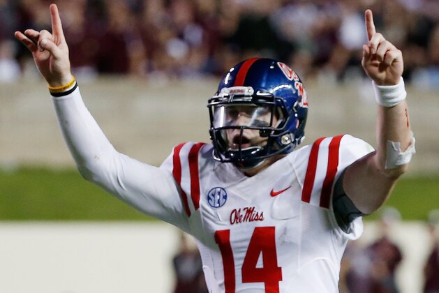 COLLEGE STATION, TX - OCTOBER 11:  Bo Wallace #14 of the Mississippi Rebels celebrates after tossing a 33-yard third quarter touchdown pass during their game against the Texas A&M Aggies at Kyle Field on October 11, 2014 in College Station, Texas.  (Photo by Scott Halleran/Getty Images)
