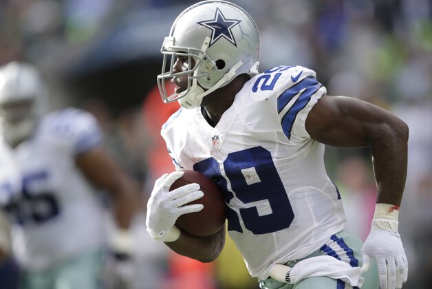 Dallas Cowboys running back DeMarco Murray runs in the first half of an NFL football game against the Seattle Seahawks, Sunday, Oct. 12, 2014, in Seattle. (AP Photo/Scott Eklund)