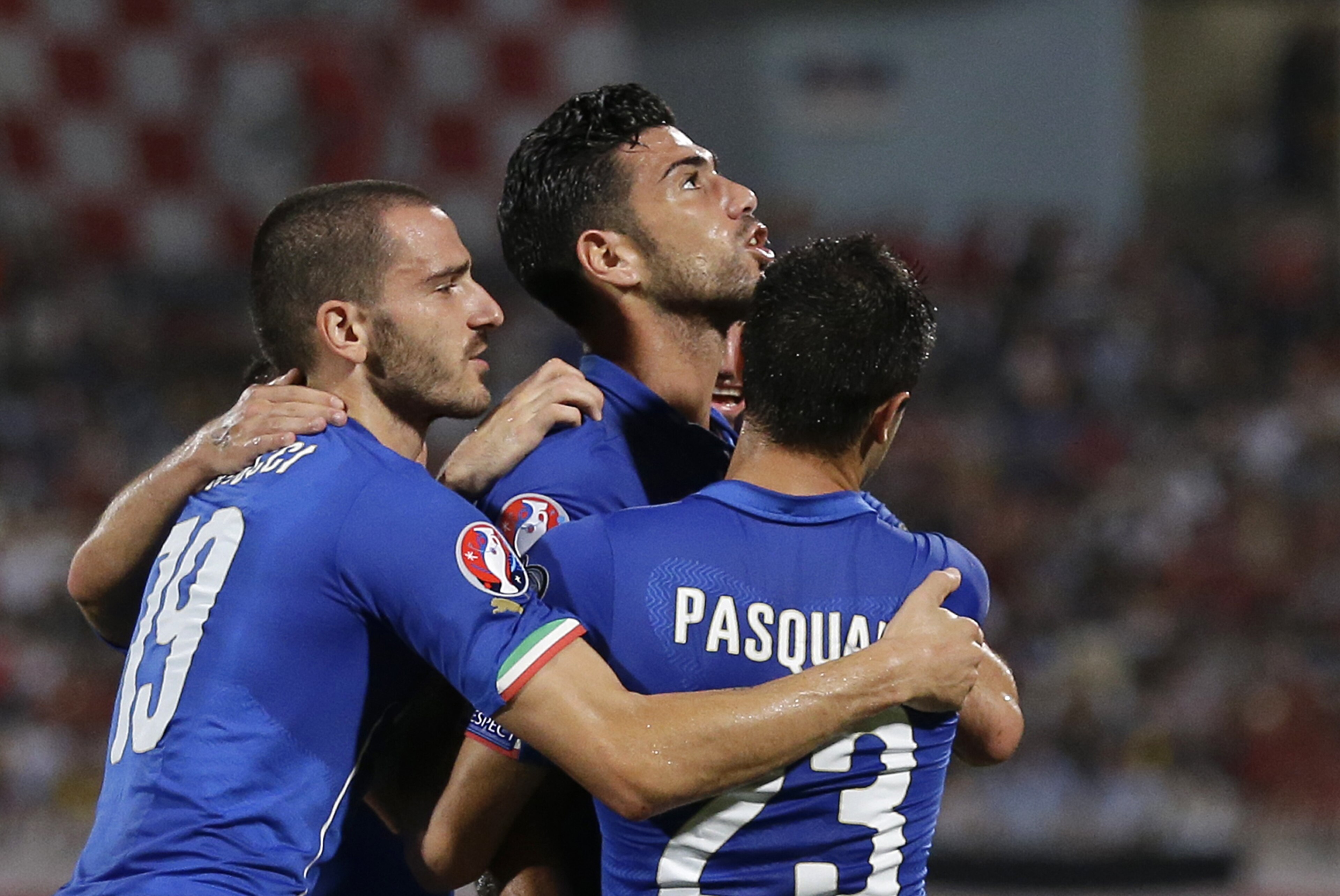 Italy’s Graziano Pelle, center, celebrates with his teammates Leonardo Bonucci, left, and Manuel Pasqual after scoring celebrates after scoring during the Euro 2016 qualifying soccer match between Malta and Italy, at the National Stadium Ta' Qali, in Valletta, Malta, Monday, Oct. 13, 2014. (AP Photo/Antonio Calanni) Italy’s Graziano Pelle, center, celebrates with his teammates Leonardo Bonucci, left, and Manuel Pasqual after scoring celebrates after scoring during the Euro 2016 qualifying soccer match between Malta and Italy, at the National Stadium Ta' Qali, in Valletta, Malta, Monday, Oct. 13, 2014. (AP Photo/Antonio Calanni)