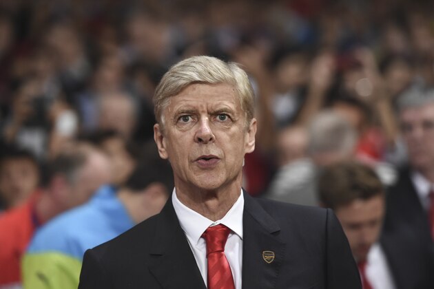 Arsenal's coach Arsene Wenger looks on during the Champions League Group D soccer match between Arsenal  and Galatasaray , at the Emirates Stadium in London, on Wednesday, Oct 1, 2014. (AP Photo/ Tim Ireland)