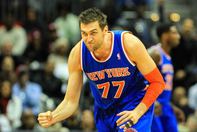 Nov 13, 2013; Atlanta, GA, USA; New York Knicks power forward Andrea Bargnani (77) celebrates a three in the second half against the Atlanta Hawks at Philips Arena. The Knicks won 95-91. Mandatory Credit: Daniel Shirey-USA TODAY Sports