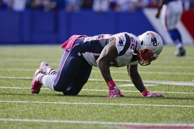 New England Patriots' Stevan Ridley (22) is slow to get up after being injured during the second half of an NFL football game against the Buffalo Bills Sunday, Oct. 12, 2014, in Orchard Park, N.Y. (AP Photo/Mike Groll)