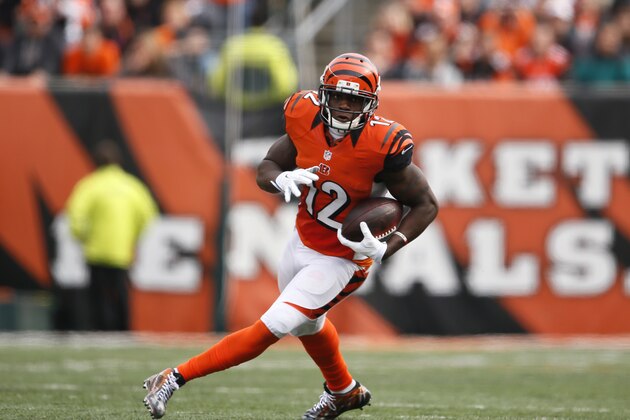 Cincinnati Bengals wide receiver Mohamed Sanu (12) runs after a catch against the Carolina Panthers in the second half of an NFL football game, Sunday, Oct. 12, 2014, in Cincinnati. (AP Photo/Paul Sancya)