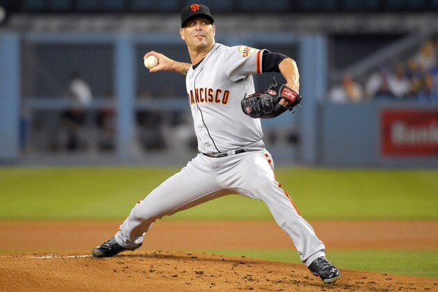 San Francisco Giants starting pitcher Tim Hudson throws to the plate during the first inning of a baseball game against the Los Angeles Dodgers, Wednesday, Sept. 24, 2014, in Los Angeles. (AP Photo/Mark J. Terrill)
