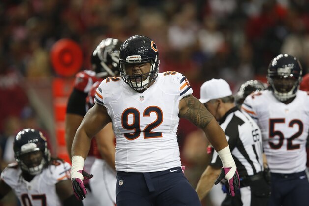 Chicago Bears defensive tackle Stephen Paea (92) reacts to a helping sack Atlanta Falcons quarterback Matt Ryan (2) during the first half of an NFL football game, Sunday, Oct. 12, 2014, in Atlanta. (AP Photo/Brynn Anderson )