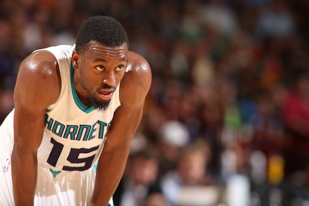 GREENVILLE, SC - OCTOBER 10:  Kemba Walker #15 of the Charlotte Hornets looks on against the Washington Wizards at Bon Secours Wellness Arena on October 10, 2014 in Greenville, South Carolina.  NOTE TO USER: User expressly acknowledges and agrees that, by downloading and or using this photograph, User is consenting to the terms and conditions of the Getty Images License Agreement.  Mandatory Copyright Notice:  Copyright 2014 NBAE (Photo by Kent Smith/NBAE via Getty Images)
