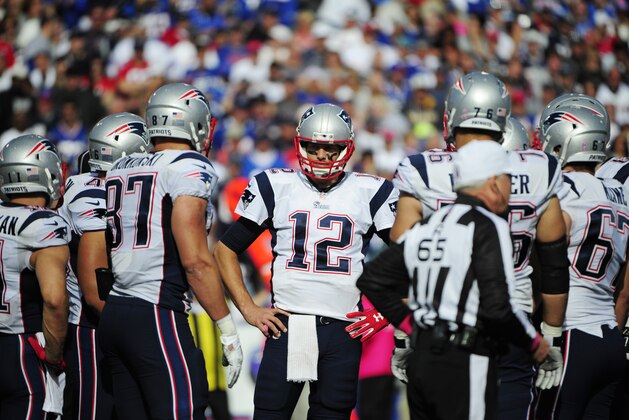 New England Patriots quarterback Tom Brady (12) stands in the huddle during the second half of an NFL football game against the Buffalo Bills Sunday, Oct. 12, 2014, in Orchard Park, N.Y. (AP Photo/Gary Wiepert)