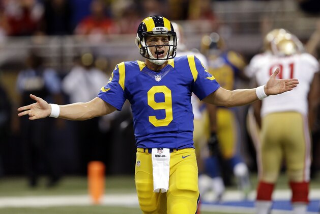 St. Louis Rams quarterback Austin Davis celebrates after running back Benny Cunningham scored a touchdown against the San Francisco 49ers in the first quarter of an NFL football game Monday, Oct. 13, 2014, in St Louis. (AP Photo/Scott Kane)