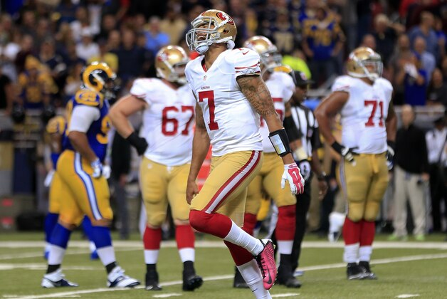 San Francisco 49ers quarterback Colin Kaepernick (7) celebrates after throwing an 11-yard touchdown pass to wide receiver Anquan Boldin against the St. Louis Rams in the third quarter of an NFL football game Monday, Oct. 13, 2014, in St Louis. (AP Photo/Billy Hurst)