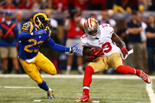 ST LOUIS, MO - OCTOBER 13:   Steve Johnson #13 of the San Francisco 49ers tries to avoid the tackle of  Rodney McLeod #23 of the St. Louis Rams in the first quarter at Edward Jones Dome on October 13, 2014 in St Louis, Missouri.  (Photo by Dilip Vishwanat/Getty Images)