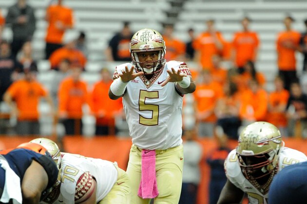 Oct 11, 2014; Syracuse, NY, USA; Florida State Seminoles quarterback Jameis Winston (5) calls a play at the line against the Syracuse Orange during the first quarter at the Carrier Dome.  Mandatory Credit: Rich Barnes-USA TODAY Sports