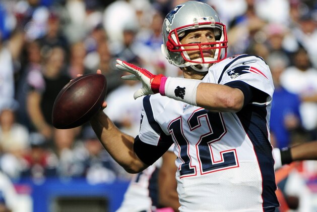 New England Patriots quarterback Tom Brady (12) passes against the Buffalo Bills during the second half of an NFL football game Sunday, Oct. 12, 2014, in Orchard Park, N.Y. (AP Photo/Gary Wiepert)