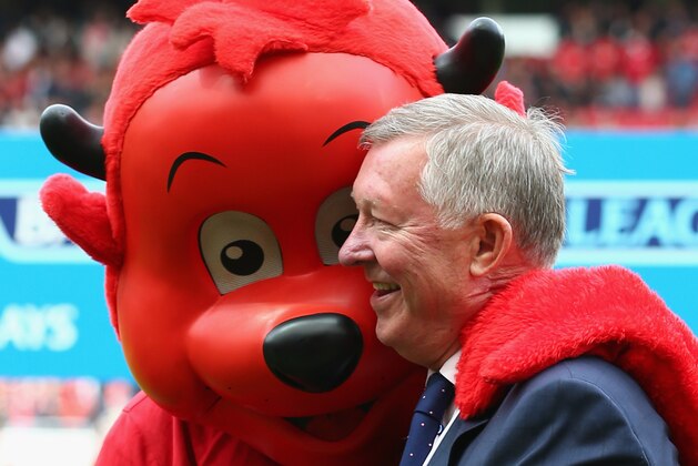 MANCHESTER, ENGLAND - OCTOBER 05: Sir Alex Ferguson looks on with Fred the Red during the Barclays Premier League match between Manchester United and Everton at Old Trafford on October 5, 2014 in Manchester, England.  (Photo by Clive Brunskill/Getty Images)