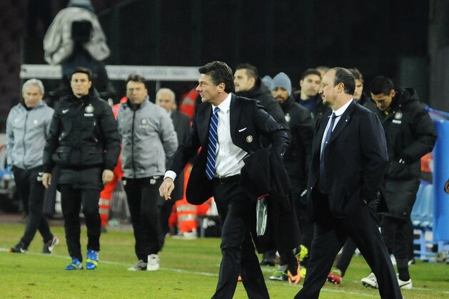 Napoli coach Rafa Benitez, right, and Inter coach Walter Mazzarri walk the pitch at the end of a Serie A soccer match between Napoli and Inter Milan, at the San Paolo stadium in Naples, Italy, Sunday, Dec, 15, 2013. (AP Photo/Salvatore Laporta)