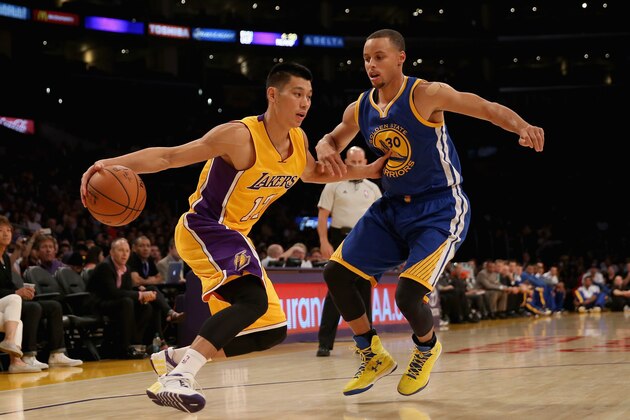 LOS ANGELES, CA - OCTOBER 09:  Jeremy Lin #17 of the Los Angeles Lakers is defended by Stephen Curry #30 of the Golden State Warriors in the first half at Staples Center on October 9, 2014 in Los Angeles, California. The Warriors defeated the Lakers 120-105. NOTE TO USER: User expressly acknowledges and agrees that, by downloading and or using this photograph, User is consenting to the terms and conditions of the Getty Images License Agreement.  (Photo by Jeff Gross/Getty Images)
