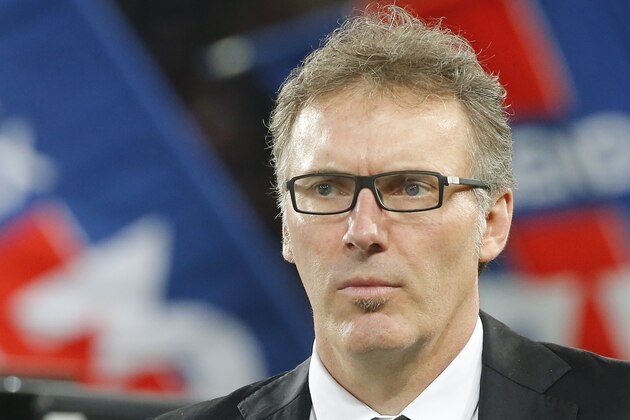 Paris Saint Germain's  French coach Laurent Blanc attends  after winning the French League One title, at the Parc des Princes Stadium, in Paris, Saturday, May. 17, 2014. Paris Saint-Germain won the French League One Championship title on Saturday, the 4th in the club's history. (AP Photo/Jacques Brinon)