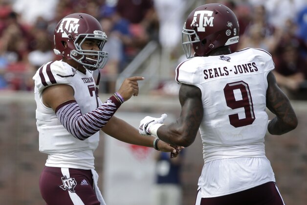 Texas A&M quarterback Kenny Hill (7) talks to wide receiver Ricky Seals-Jones (9) after Hill threw an interception to SMU in the first  half of an NCAA college football game,  Saturday, Sept. 20, 2014, in Dallas. (AP Photo/Tony Gutierrez)