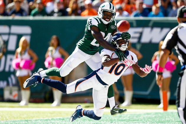 EAST RUTHERFORD, NJ - OCTOBER 12:  Phillip Adams #24 of the New York Jets breaks up a pass intended to Emmanuel Sanders #10 of the Denver Broncos in the second quarter at MetLife Stadium on October 12, 2014 in East Rutherford, New Jersey.  (Photo by Jeff Zelevansky/Getty Images)