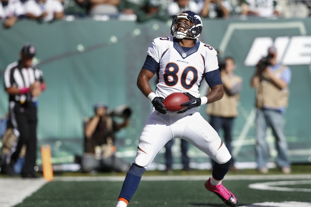 Denver Broncos tight end Julius Thomas (80) comes down with a touchdown pass against the New York Jets during the third quarter of an NFL football game, Sunday, Oct. 12, 2014, in East Rutherford, N.J. (AP Photo/Kathy Willens)