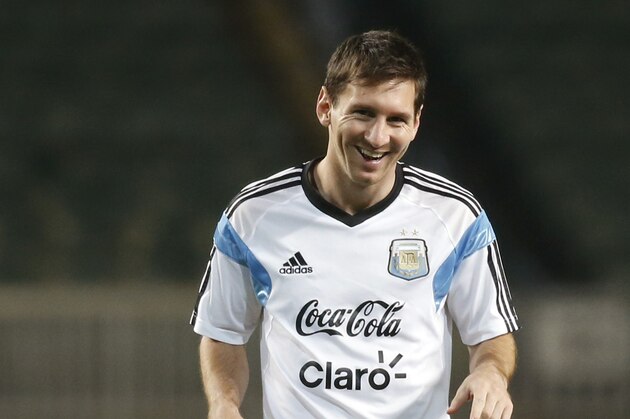 Argentina's Lionel Messi smiles during a training session in Hong Kong Monday, Oct. 13, 2014. Argentina will play a friendly soccer match against Hong Kong on Tuesday, Oct. 14.  (AP Photo/Kin Cheung)