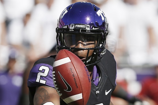TCU quarterback Trevone Boykin (2) tosses the ball to a teammate during the first half of a NCAA college football game against Oklahoma at Amon G. Carter Stadium, Saturday, Oct. 4, 2014, in Fort Worth, Texas. TCU won 37-33. (AP Photo/Brandon Wade) TCU quarterback Trevone Boykin (2) tosses the ball to a teammate during the first half of a NCAA college football game against Oklahoma at Amon G. Carter Stadium, Saturday, Oct. 4, 2014, in Fort Worth, Texas. TCU won 37-33. (AP Photo/Brandon Wade)