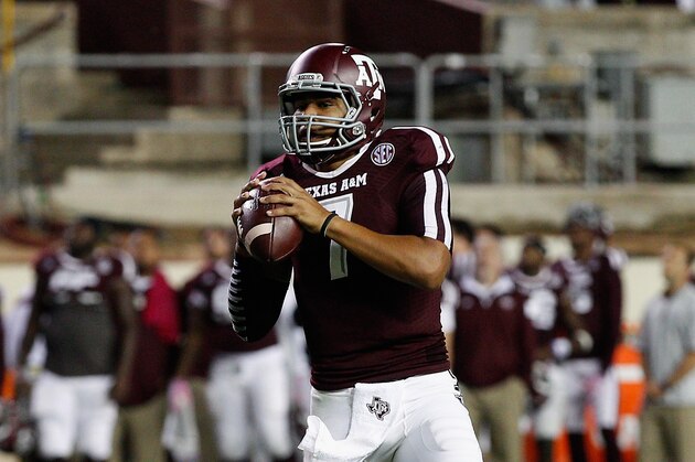 Texas A&M quarterback Kenny Hill (7) looks for a receiver against Mississippi during the fourth quarter of an NCAA college football game Saturday, Oct. 11,  2014, in College Station, Texas. (AP Photo/Bob Levey)